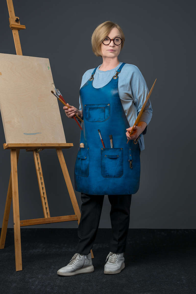 lady in blue leather apron